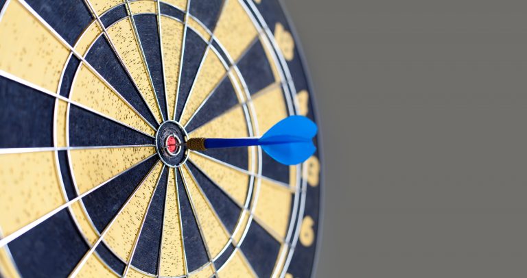 Photography of vintage yellow and black colors darts. Success hitting
